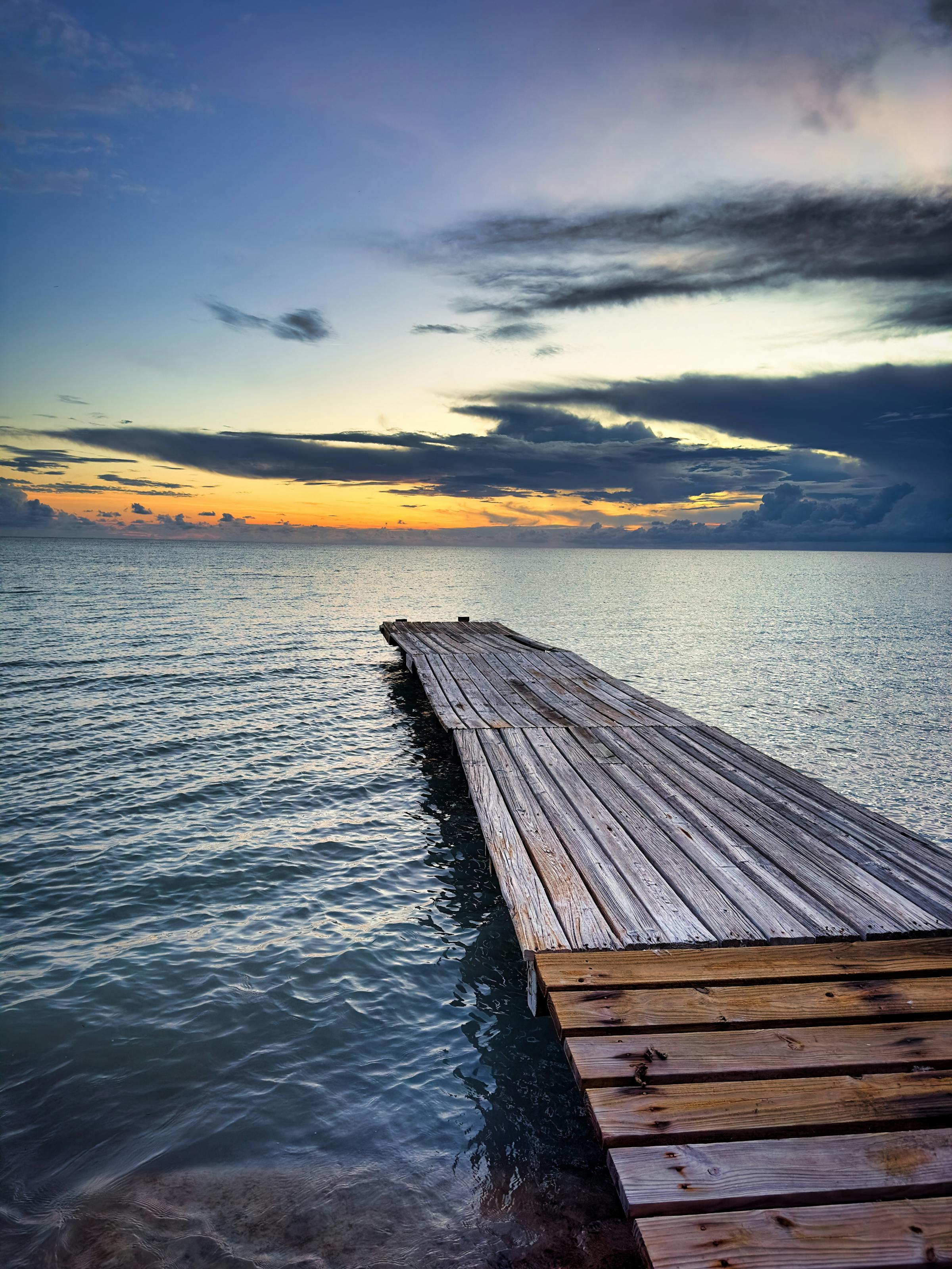Serene sunset over a wooden pier at Cabo Rojo, Puerto Rico
