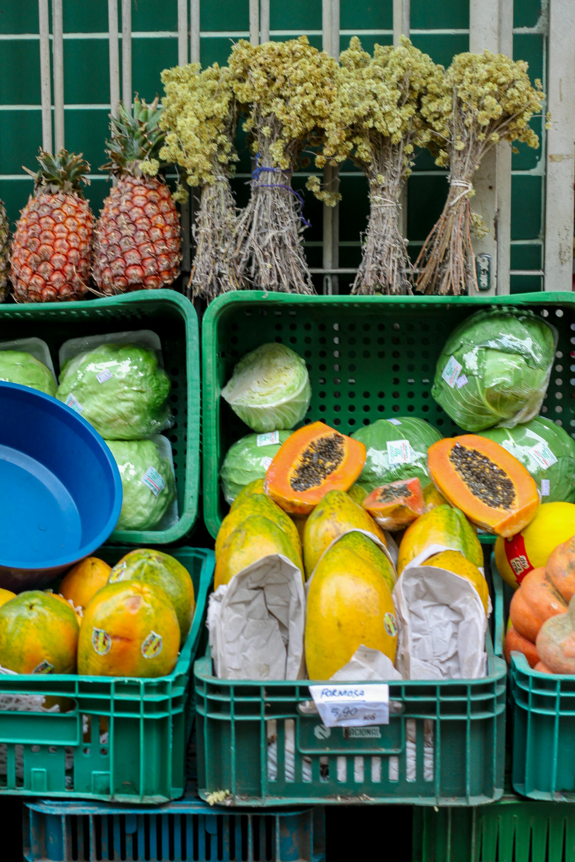 Fresh exotic tropical fruits and vegetables at a vibrant local outdoor market